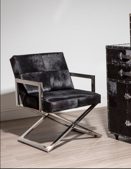 "Chrome Cross Leg Chair with white upholstery next to cupboard"