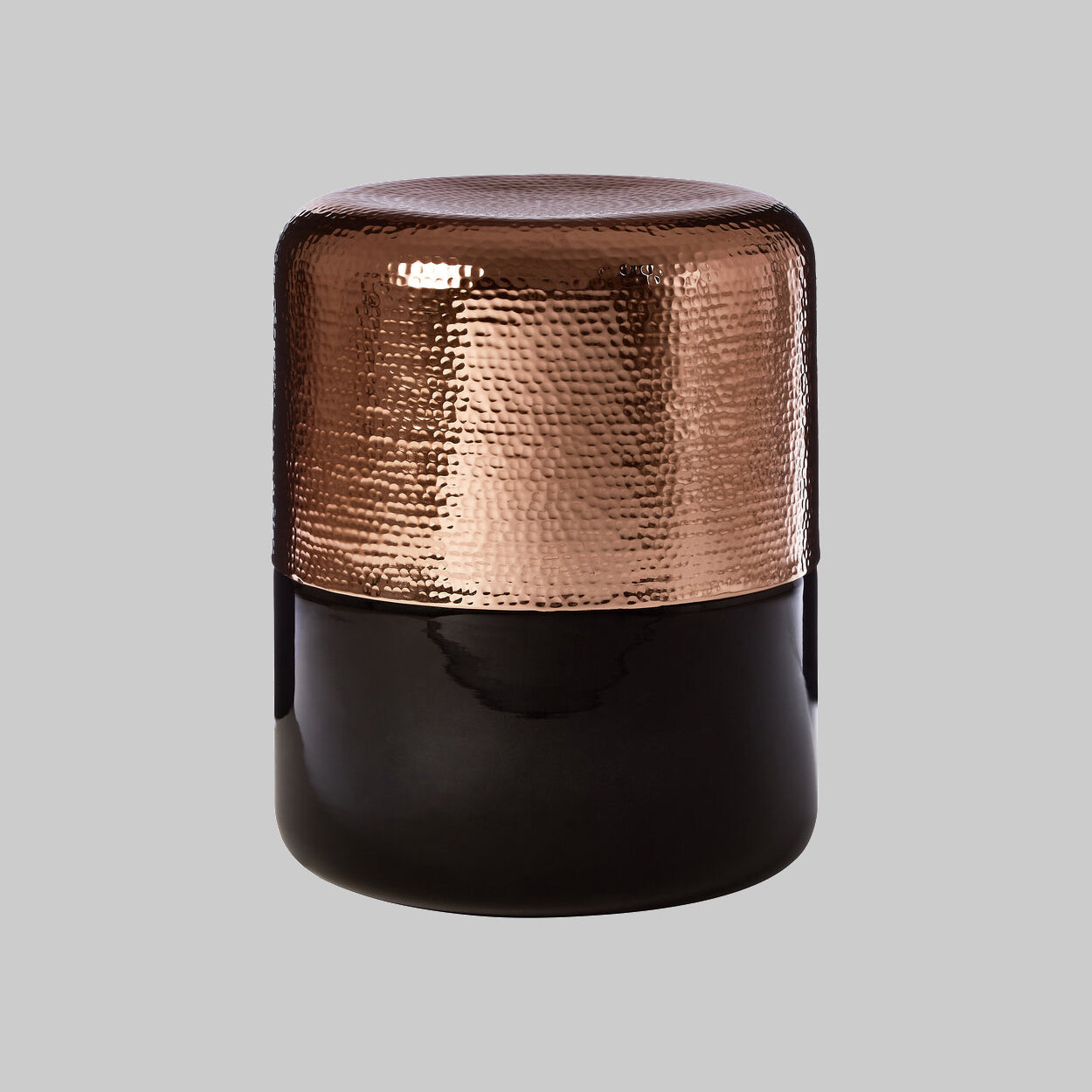"Black Glass and Copper side table on grey background"