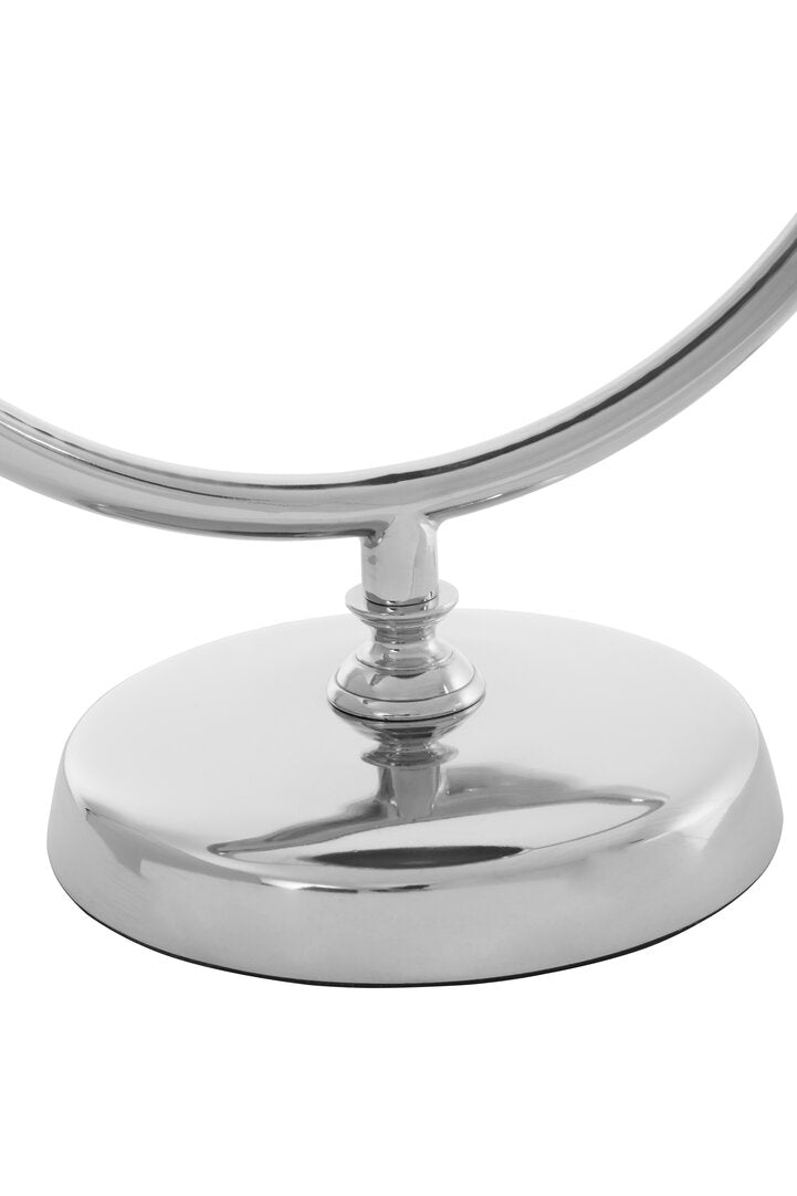 "Chrome circular lamp on a white background"