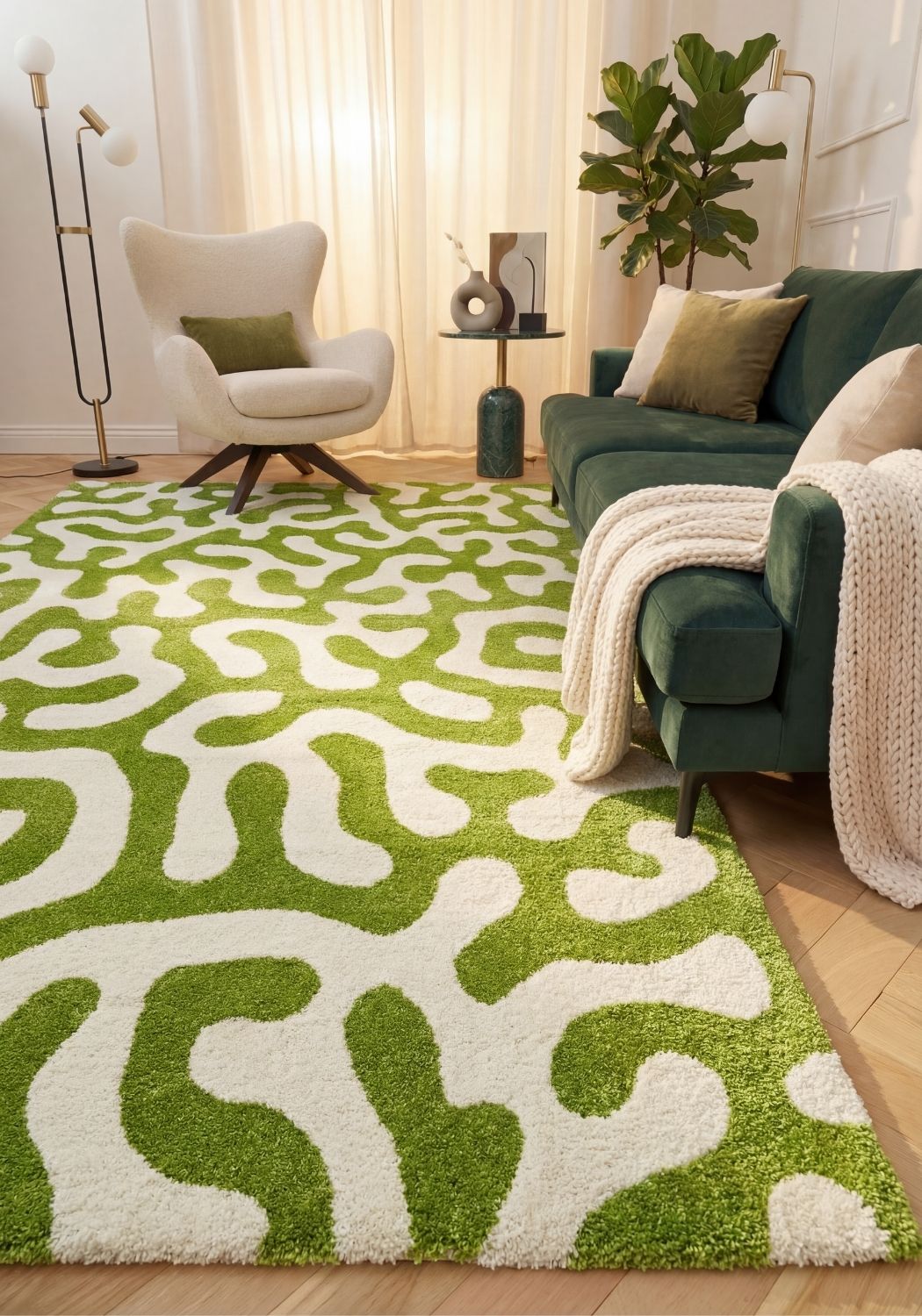 Living room with a green and white patterned rug, green sofa, and armchair.