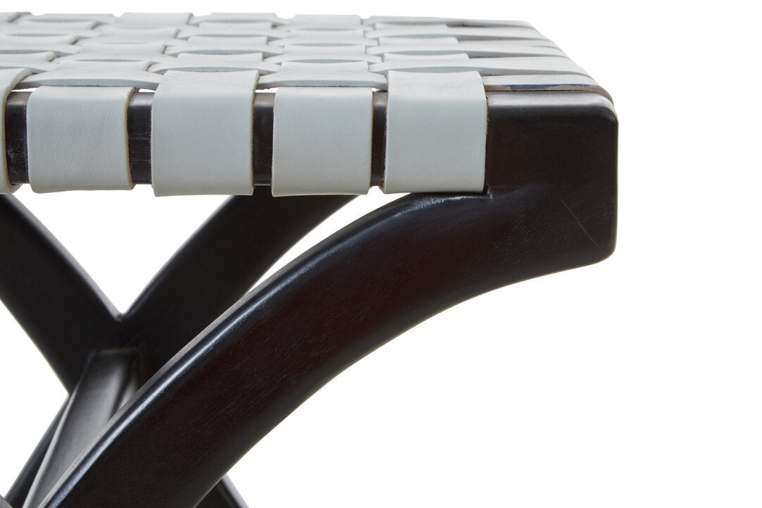 Close-up of a chair with woven seat and dark wooden frame on a white background