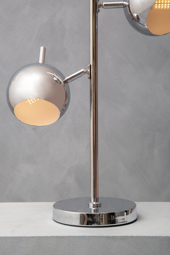 Modern table lamp with two adjustable lights on a gray background