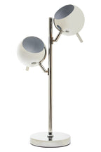 Modern table lamp with two spherical shades on a white background