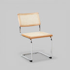 DESSAU Bauhaus-inspired rattan and tubular steel cantilever dining chair KEFINO