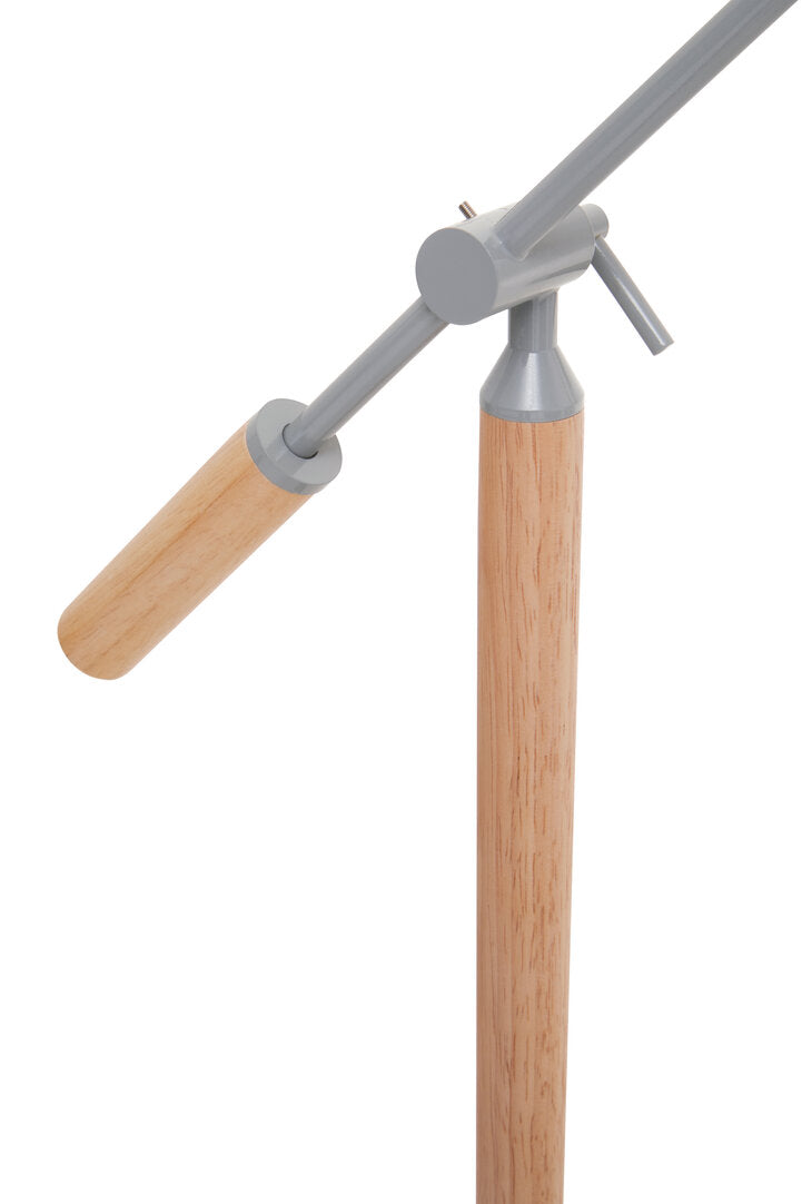 Movable lamp joint with wooden legs and grey metal joints on a white background