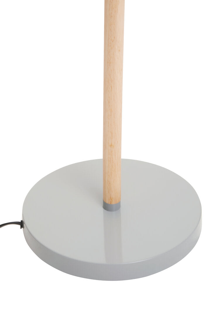 Floor lamp with wooden pole and gray concrete base on a white background