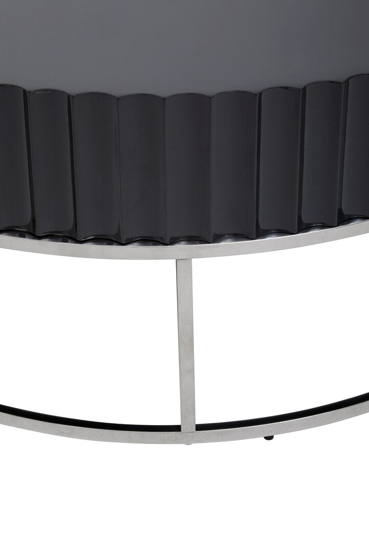 Detail of Round Black coffee table on stainless steel  base on white background