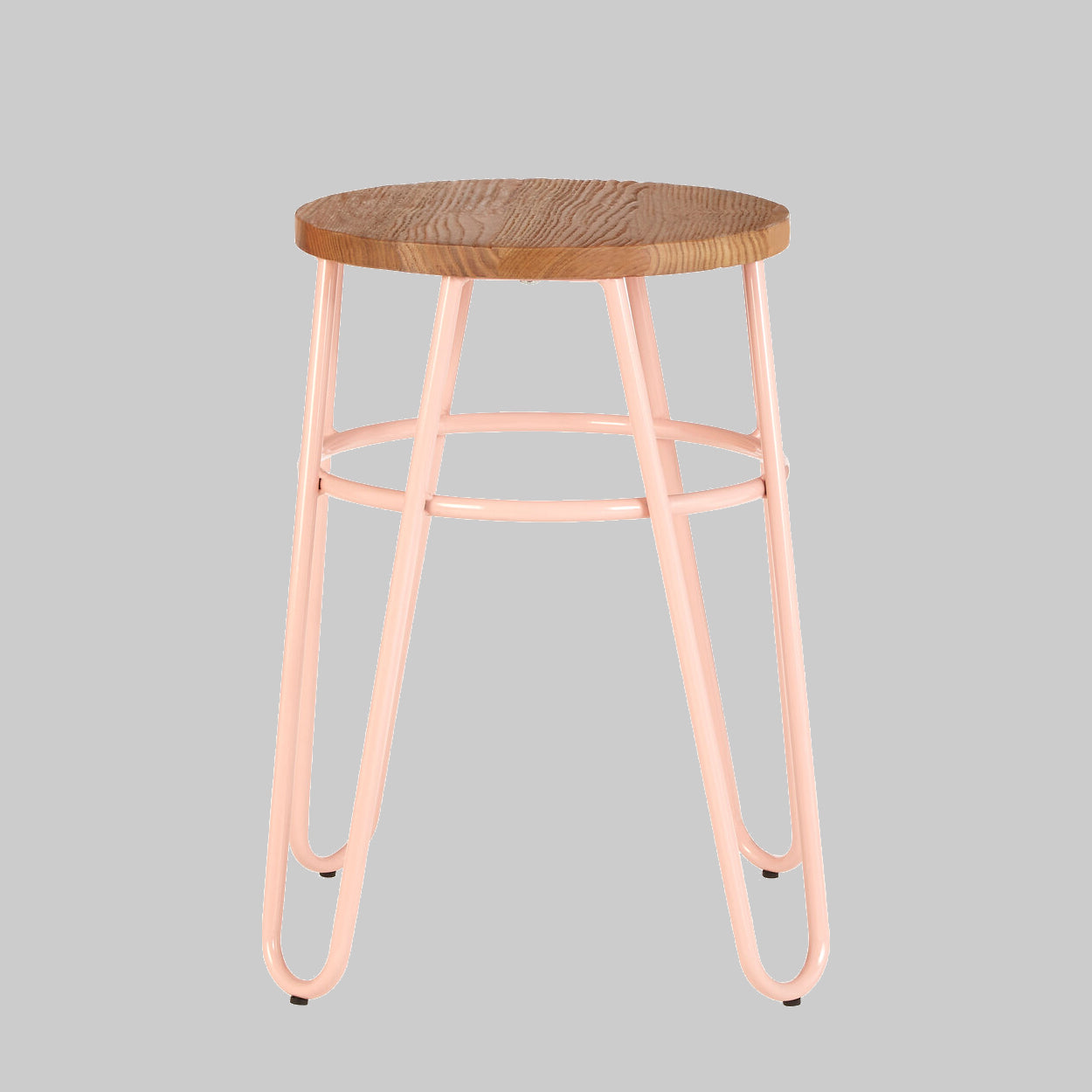 Bar stool with wooden seat and pink metal frame on a gray background