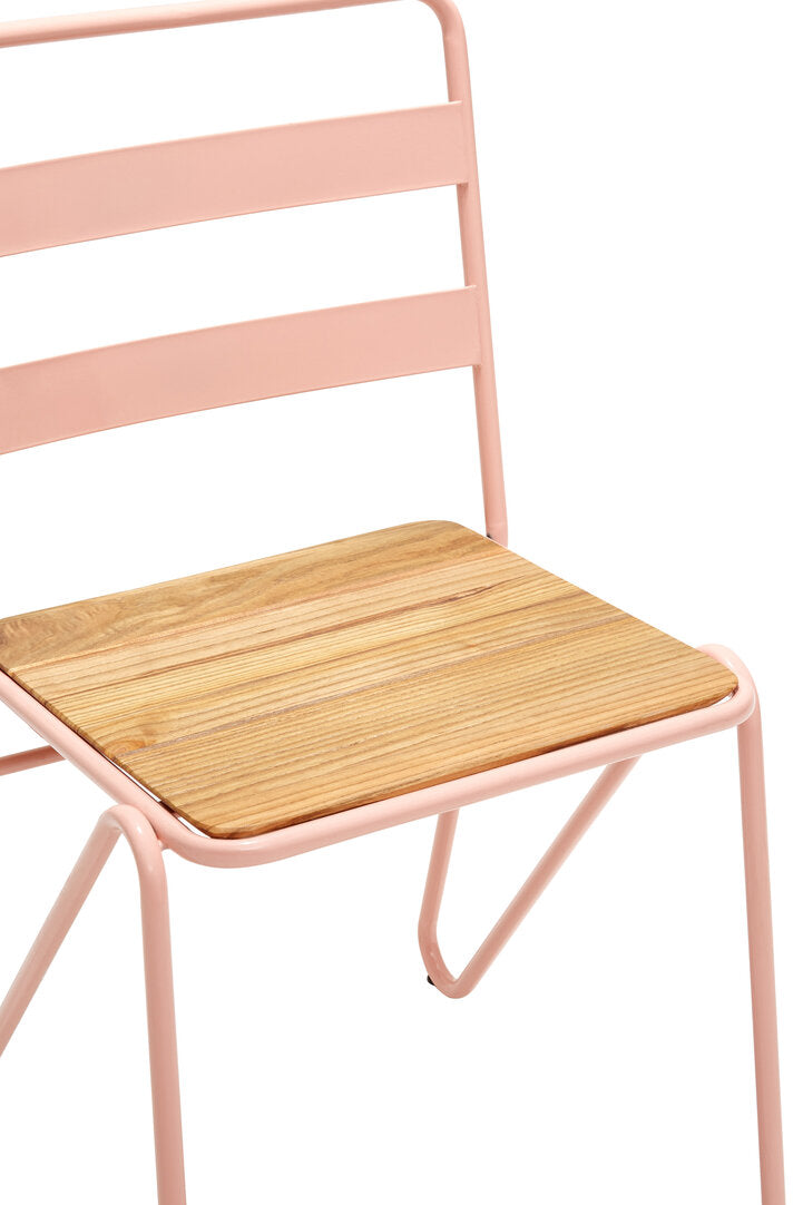 Pink metal chair with a wooden seat on a white background