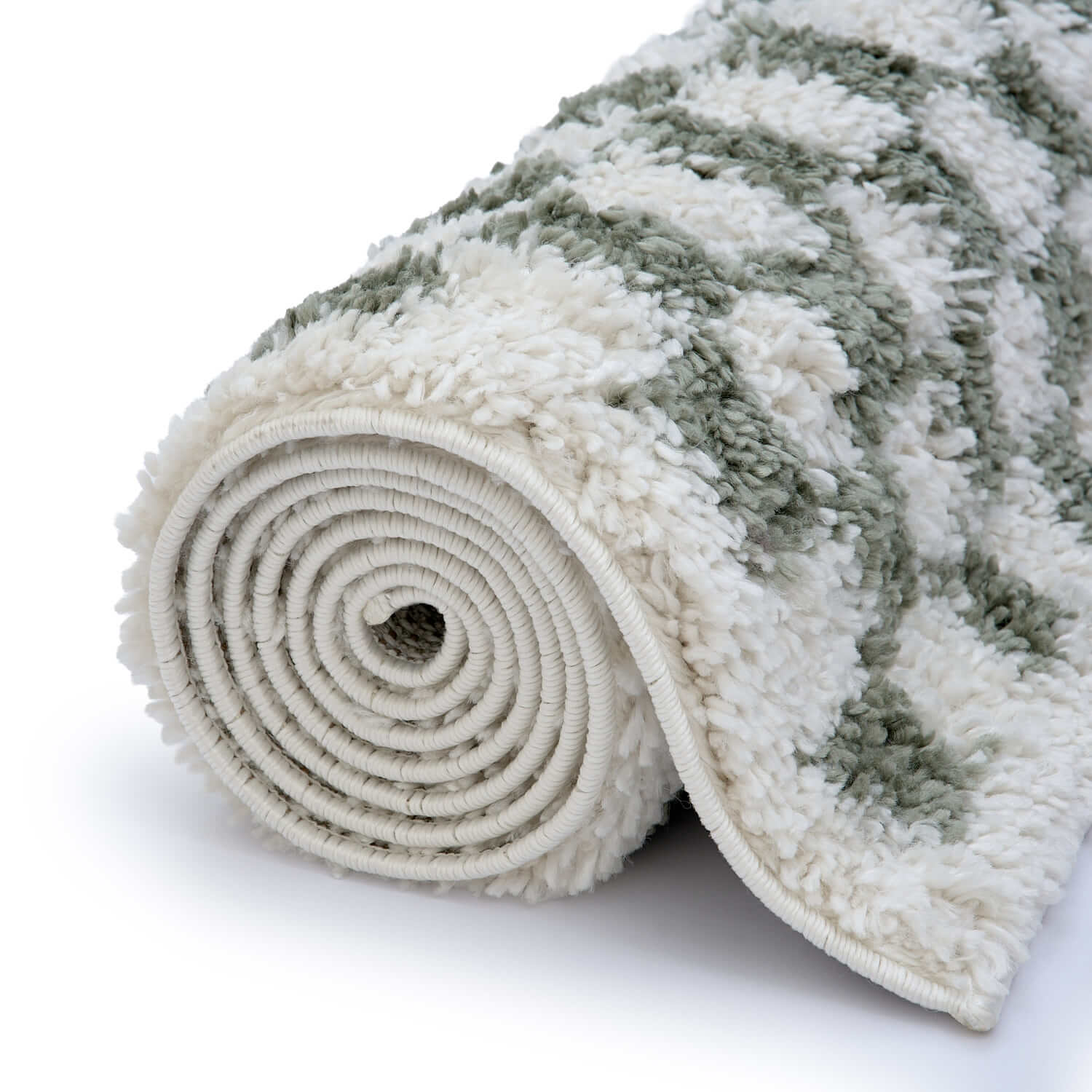 Rolled-up textured rug with a pattern on a white background