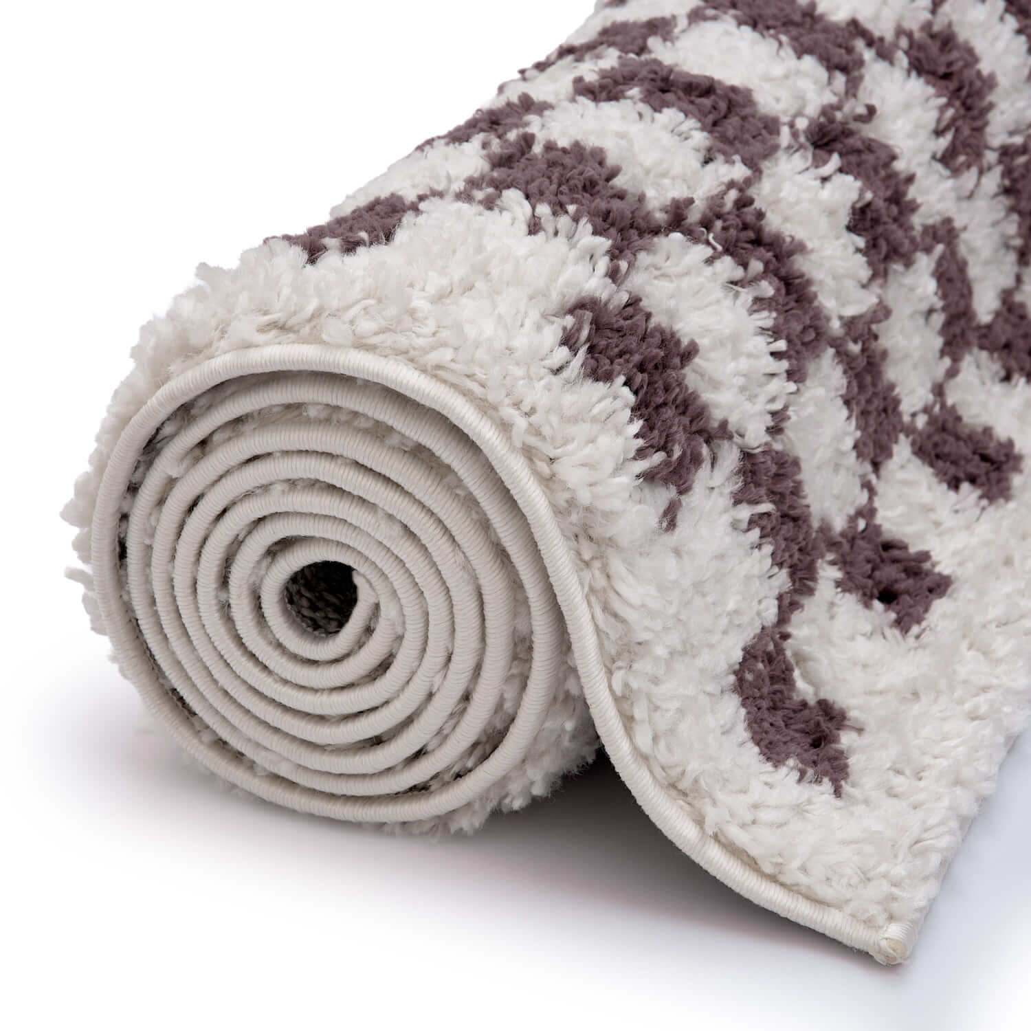 Rolled-up rug with purple pattern on a white background