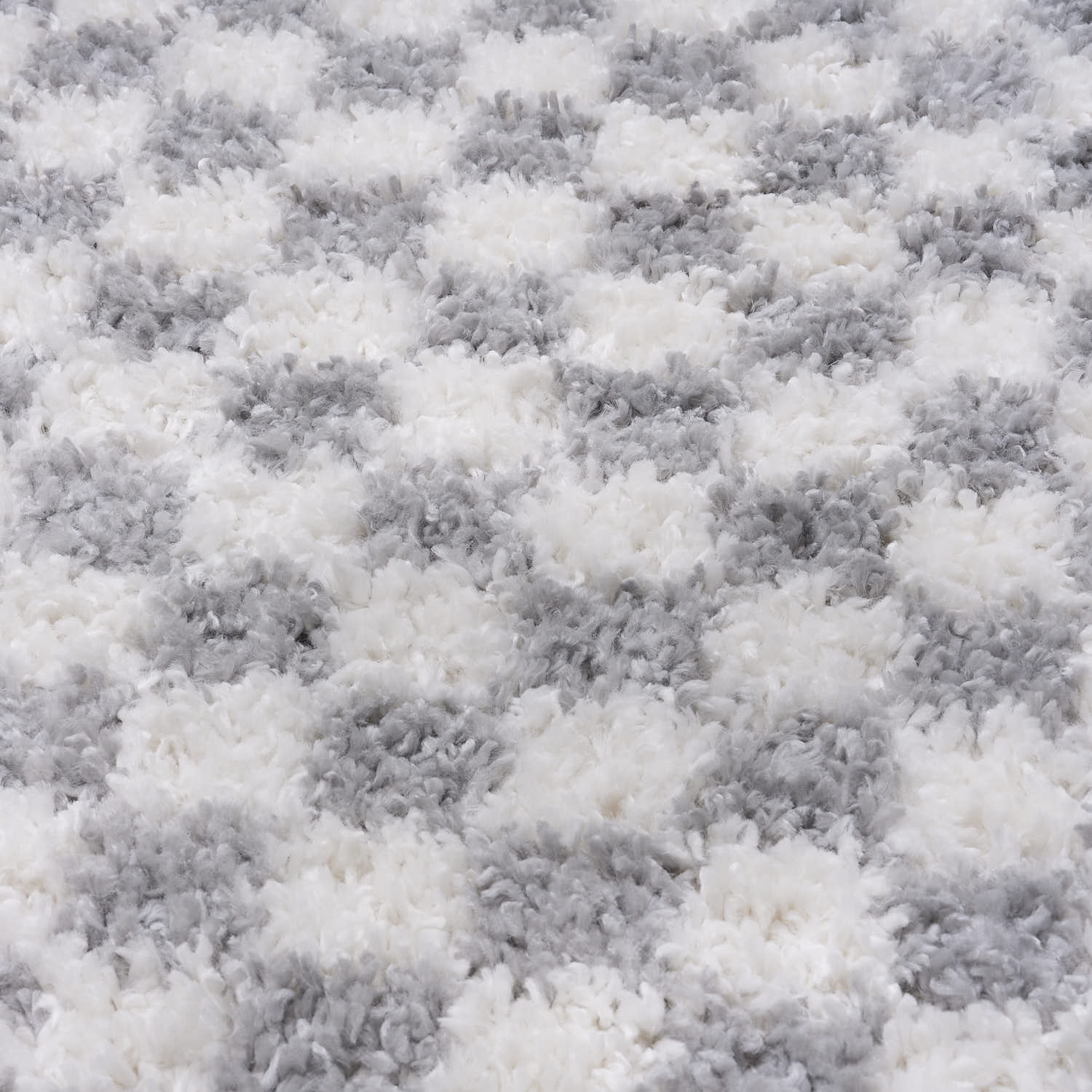 Close-up of a textured gray and white rug