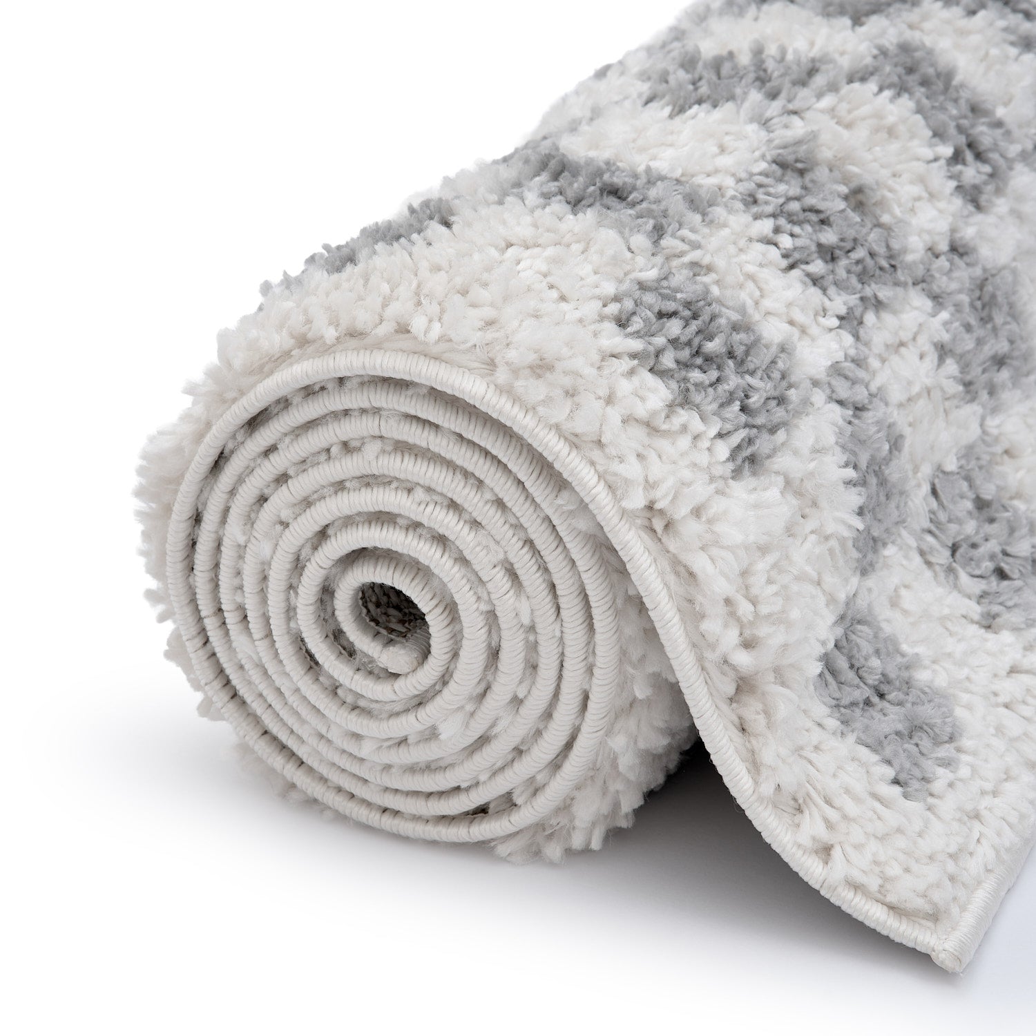 Rolled-up gray and white textured rug on a white background