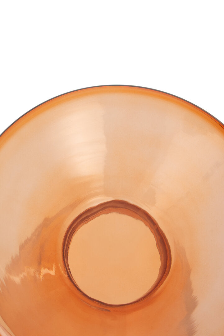 Close-up of an orange glass bowl on a white background