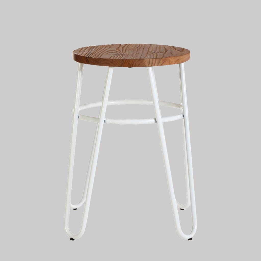Bar stool with wooden seat and white metal legs on a gray background