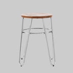 Bar stool with wooden seat and metal legs on a gray background