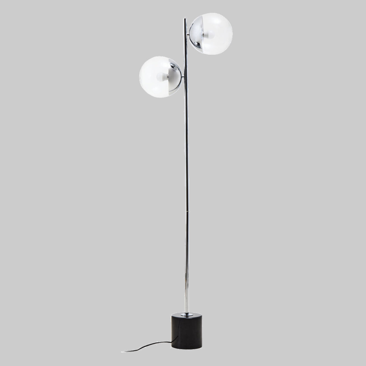 Modern floor lamp with two spherical glass shades on a gray background