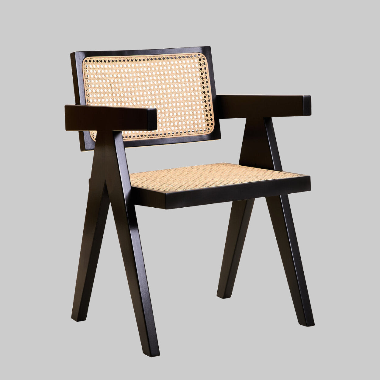 Chair with black frame and woven seat and backrest on a gray background