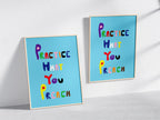 Two Practice What you Preach Poster on Blue Background in Wooden Frames