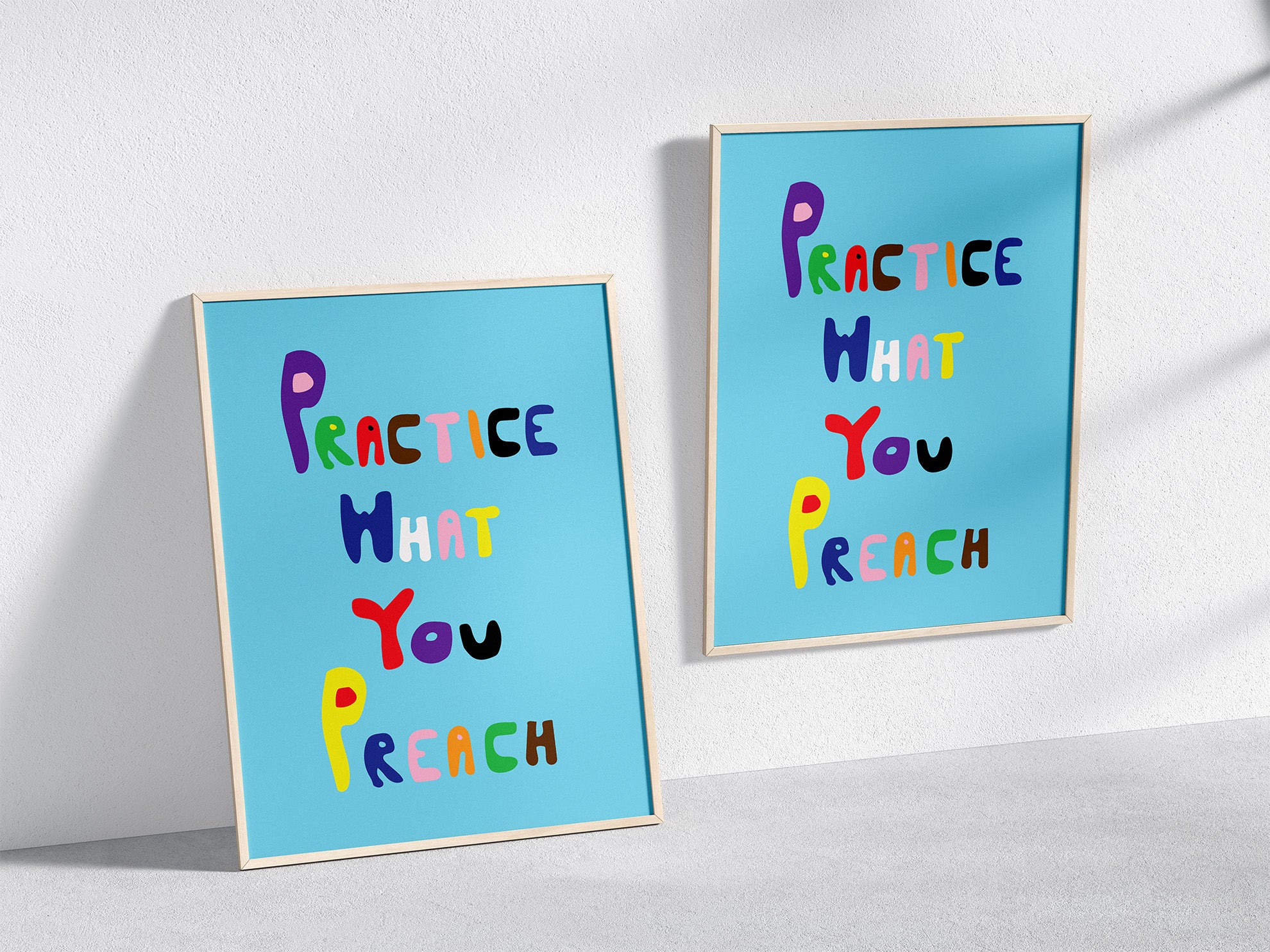 Two Practice What you Preach Poster on Blue Background in Wooden Frames