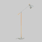 Floor lamp with a grey shade and wooden base on a light grey background