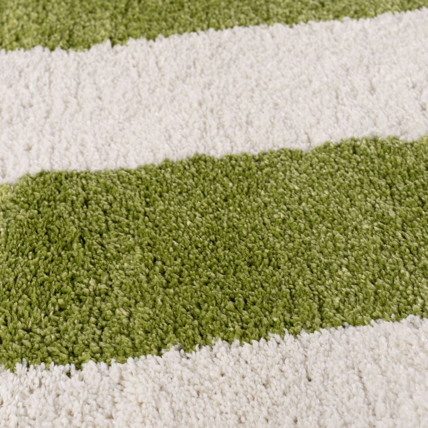 Close-up of a striped green and white rug