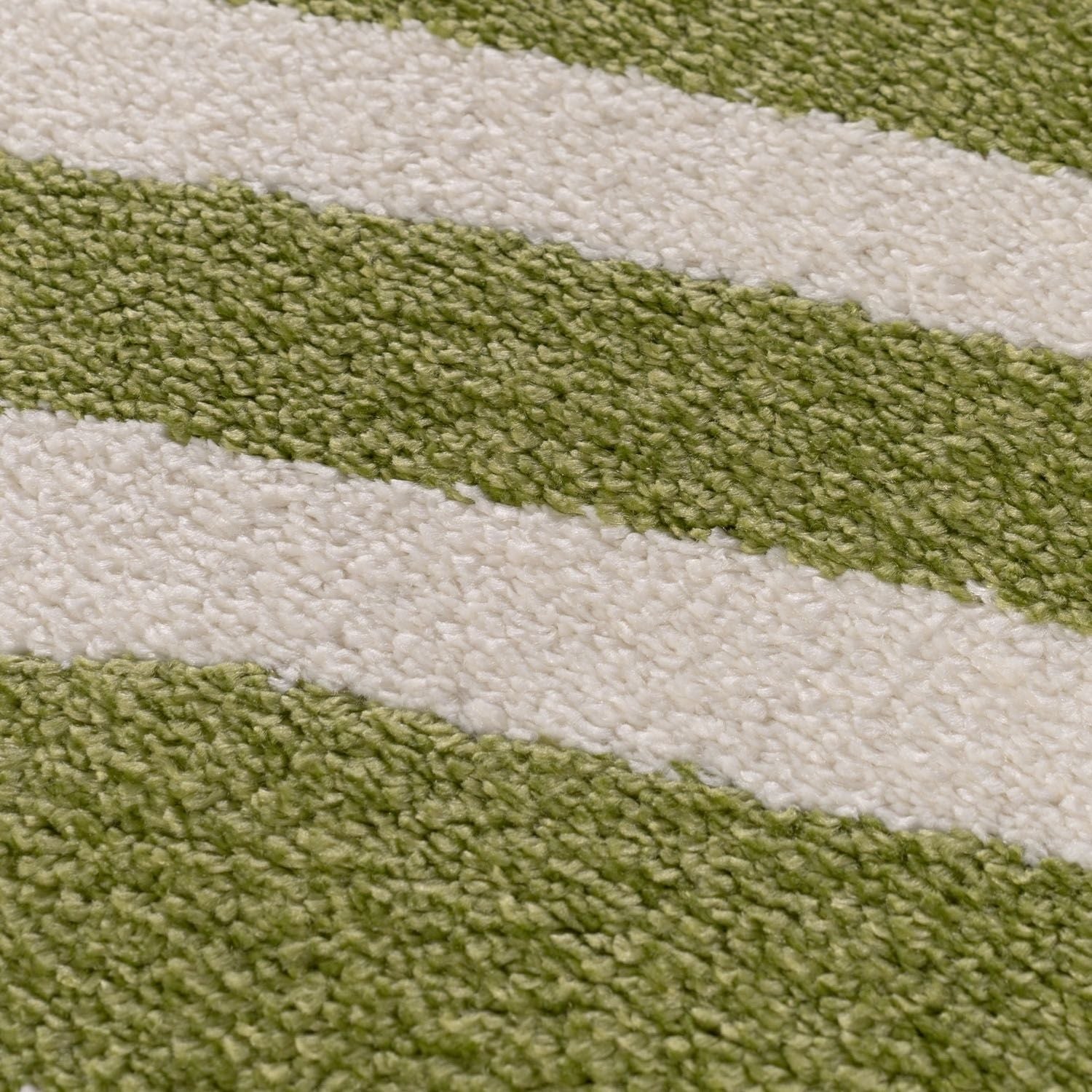 Close-up of a green and white striped fabric texture