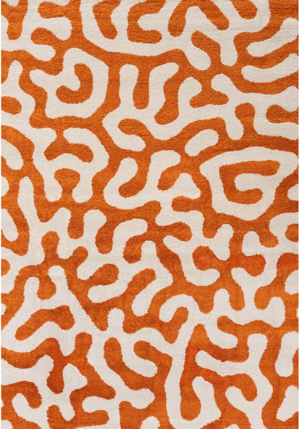 Patterned rug with orange and white design