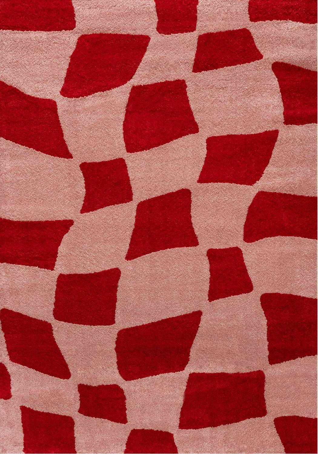 Red and pink patterned rug with geometric shapes