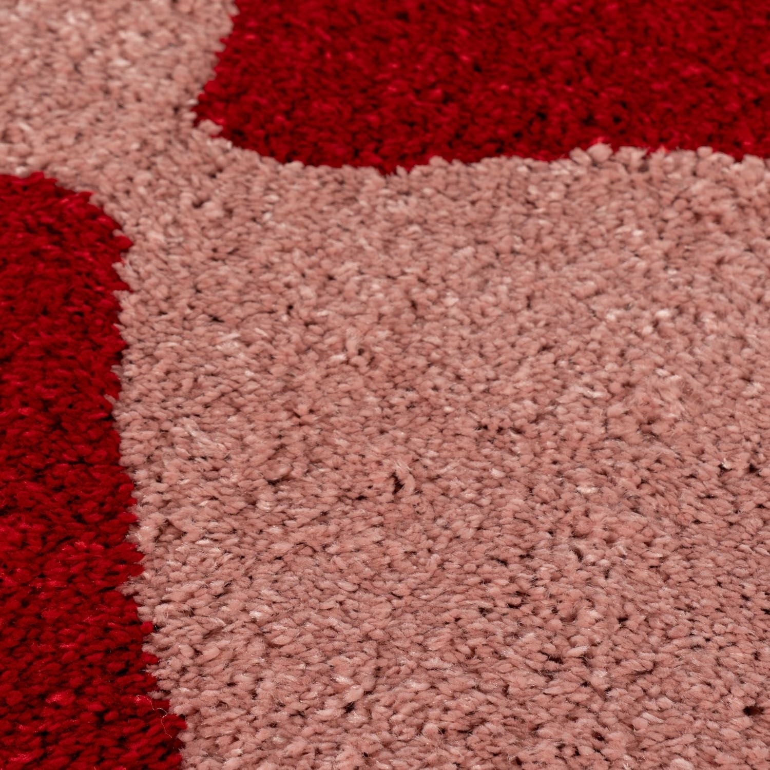 Close-up of red and pink textured carpet