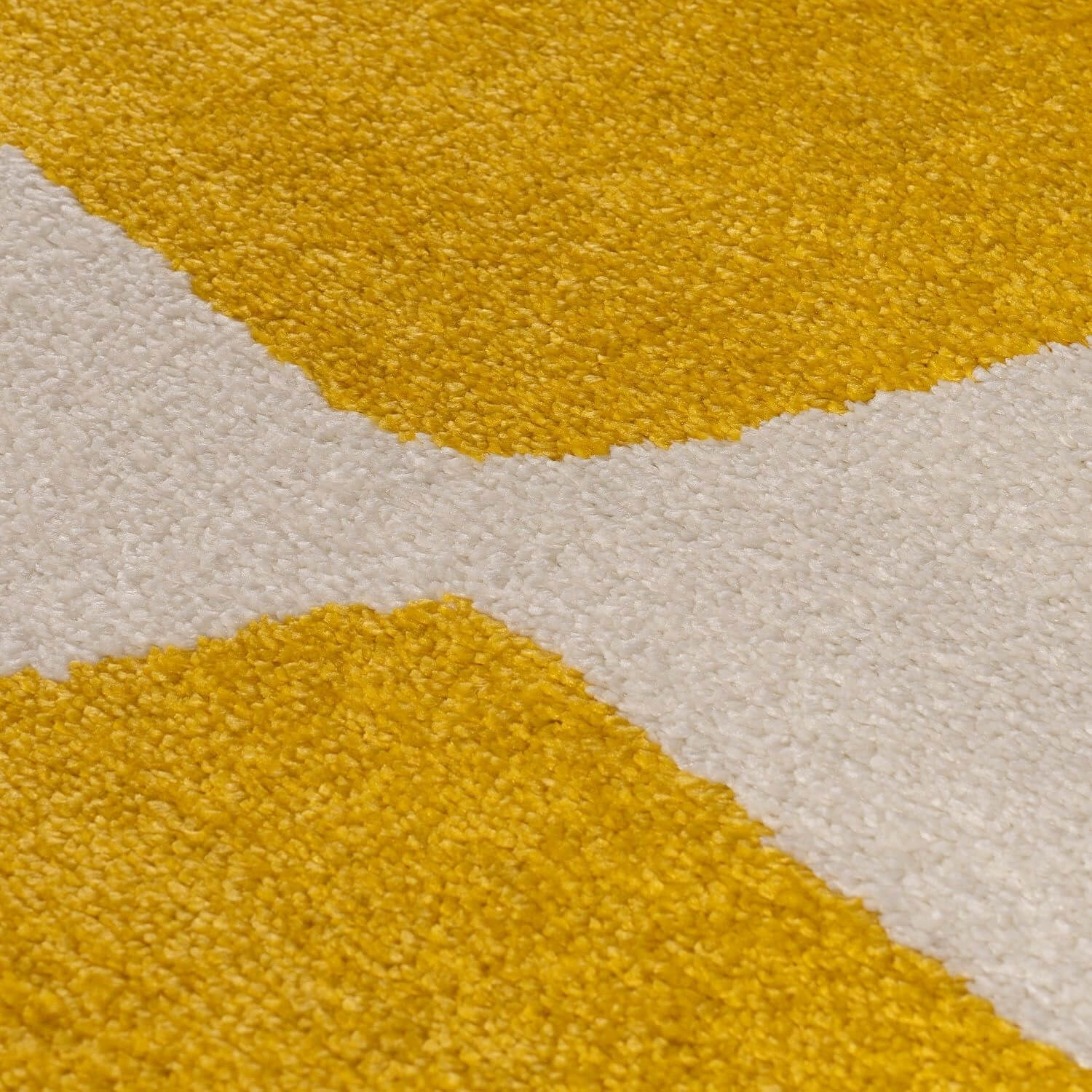 Close-up of a textured yellow and white rug
