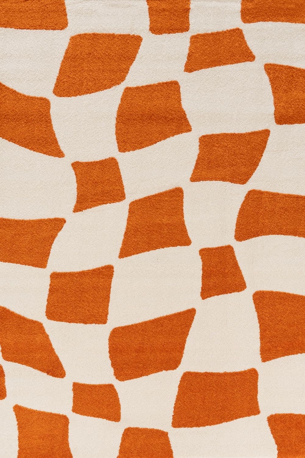 Patterned orange and white rug texture